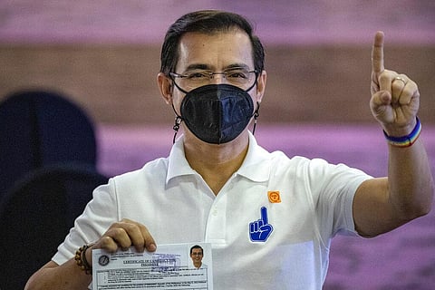 Manila City Mayor Isko Moreno gestures after filing his certificate of candidacy for next year's presidential elections before the Commission on Elections. (Photo | AP)