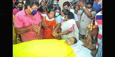 K S Bindu, mother of Nithinamol, who was killed by her classmate, was inconsolable when the body was brought to the house at Thalayolaparambu. (Photo | Express)