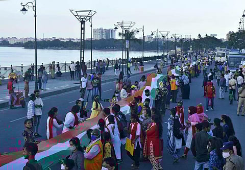 Lions Club members display the 1-km-long National at Tank Bund in Hyderabad. (Photo| S Senbagapandiyan, EPS)
