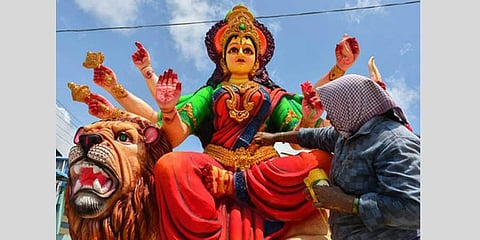 Artists gives final touches to idols of Goddess Kanaka Durga ahead of Dussehra festival at Nunna near Vijayawada on Monday. (Express photo | Prasant Madugula)