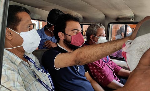 Crime Branch officials taking Monson Mavunkal after inspecting his house in Kaloor, Kochi. (FIle photo | A Sanesh, EPS)