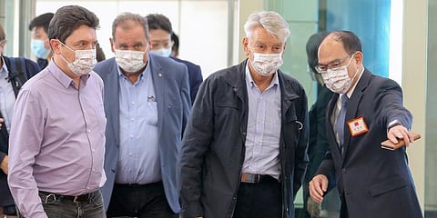 French senator Alain Richard, second right, is escorted by a Taiwanese official upon arrival at Taoyuan International Airport in Taiwan. (Photo | AP)