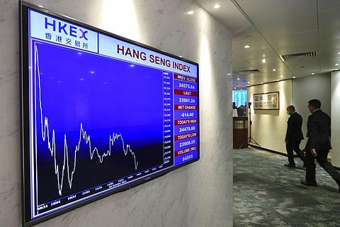 A screen displays the Hong Kong share index at the Hong Kong Stock Exchange Monday, Oct. 4, 2021. (Photo | AP)