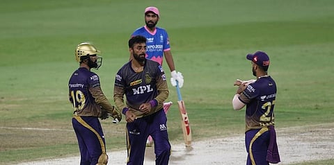 KKR's Varun Chakravarthy celebrates the fall of a wicket with teammates. (Photo | Twitter/IPL)