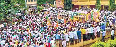 BJP workers accompany party candidate Shivaraj Sajjanar while filing his nomination papers for the Hanagal Assembly bypoll on Friday