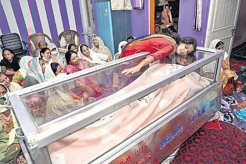 Wife of Deepak Chand, a teacher who was killed by militants in Srinagar on Thursday, during his funeral ceremony in Jammu on Friday | PTI