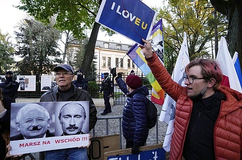 People stage a protest in front of Poland's constitutional court, in Warsaw, Poland. (Photo | AP)