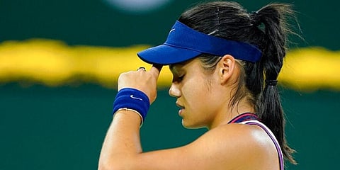 Emma Raducanu wipes her head after losing a point. (Photo | AP)