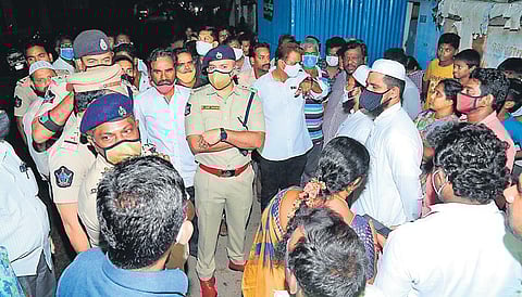 Guntur Urban SP Arif Hafeez interacting with people in Railpet under programme to adopt problematic areas in the city to make it crime-free I Express