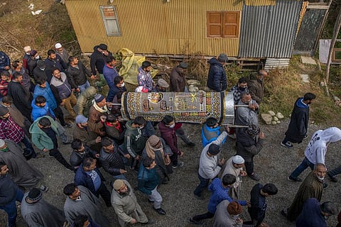 Kashmiris walk in the funeral procession of Mohd Ibrahim Khan during his funeral in Srinagar. (Photo | AP)