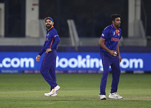 India's captain Virat Kohli, left, and Ravichandran Ashwin react after a review for the wicket of Scotland's Chris Greaves. (Photo | AP)