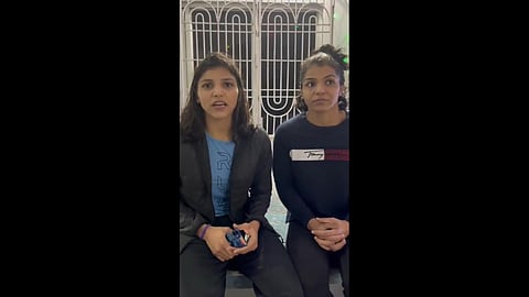Wrestler Nisha Dahiya assures of her wellness along with Sakshi Malik in a video released by Wrestling Federation of India. (Photo | Twitter, Wrestling TV Ind)