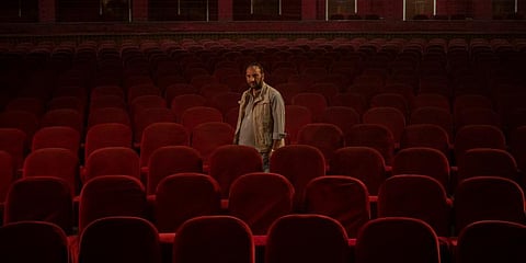 Gul Mohammed, who works as a host in the Ariana Cinema, poses for a photograph in Kabul, Afghanistan. (Photo | AP)
