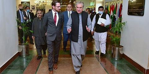 Pakistan Foreign Minister Shah Mahmood Qureshi, center front, arrives with the special envoys from United States, Russia and China, prior to a meeting on Afghanistan, in Islamabad. (Photo | AP)