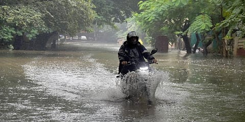 Residents of Chennai's Ashok Nagar 19th avenue wading through knee-deep water. (Photo | Ashwin Prasath, EPS)