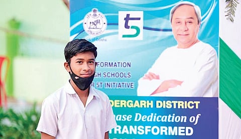 A student poses for a photo in Sundargarh ahead of inauguration of his school.