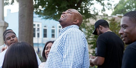 Dontae Sharpe breathes fresh air outside the Pitt County Courthouse after a judge determined he could be set free. (Photo | AP)