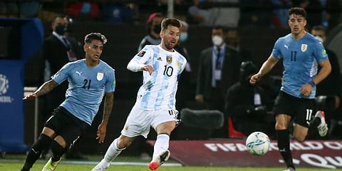Argentina's Lionel Messi, 10, kicks a ball during a qualifying soccer match against Uruguay for the FIFA World Cup Qatar 2022. (Photo | AP)