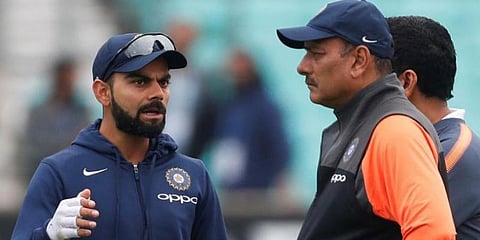 India captain Virat Kohli (L) with former head coach Ravi Shastri (Photo | AFP)
