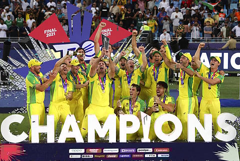 Australian cricketers hold the trophy and celebrate after winning the Cricket Twenty20 World Cup final match in Dubai, UAE, Sunday, Nov. 14, 2021. (Photo | AP)