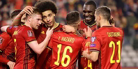Thorgan Hazard (C) is congratulated after scoring his sides third goal during the World Cup 2022 group E qualifying match between Belgium and Estonia. (Photo | AP)
