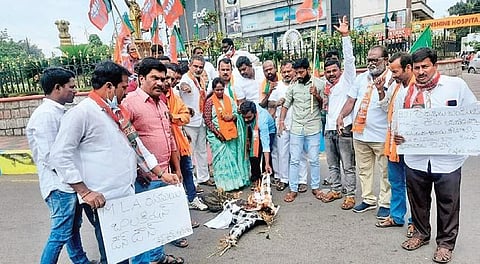 BJP activists set fire to TRS leader and Manakondur MLA Rasamayi Balakishan’s effigy at Court Cross Roads in Karimnagar on Saturday