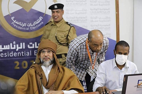 Seif al-Islam, left, the son and one-time heir apparent of late Libyan dictator Moammar Gadhafi registers his candidacy for the country’s presidential elections in December 2021. (Photo | AP)
