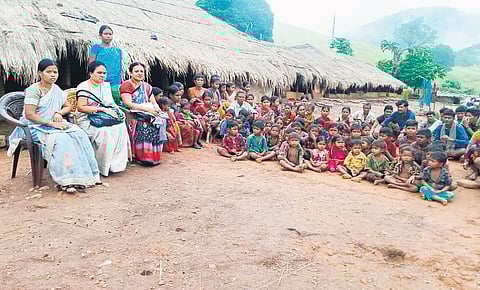 A five-member ICDS team from G Madugula visits Boddu Mamidi and Nitta Mamidi hilltop villages for enumeration of children on Sunday I Express