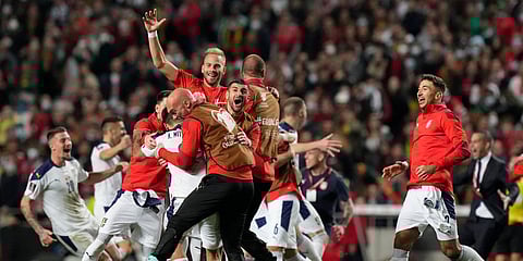 Serbian players celebrate at the end of the FIFA World Cup qualifying match against Portugal at the Luz stadium in Lisbon. (Photo| AP)