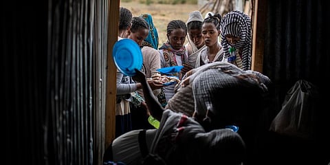 Tigrayans stand in line to receive food donated by local residents at a reception center for the internally displaced in Mekele, in the Tigray region of northern Ethiopia. (Photo | AP)