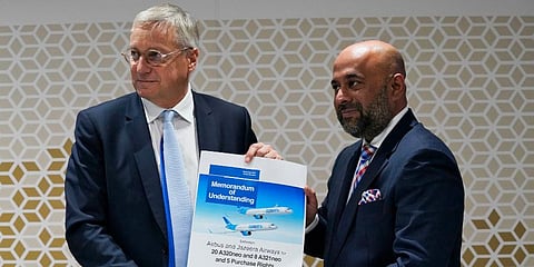 Airbus CCO Christian Scherer (L) and Jazeera Airways CEO Rohit Ramachandran show a commemorative memorandum of understanding for an aircraft sale at the Dubai Air Show. (Photo | AP)