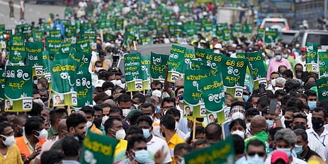 Sri Lankans participate in a protest accusing the government of not taking action to curb the rising cost of living in Colombo, Sri Lanka, Nov. 16, 2021. (Photo | AP)