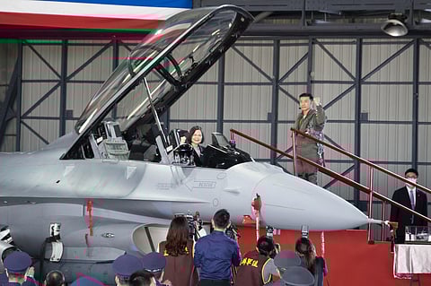 Taiwan's President Tsai Ing-wen poses for photos from the cockpit during a ceremony to commission into service 64 upgraded F-16V fighter jets at an Air Force base in Chiayi in southwestern Taiwan.(AP)