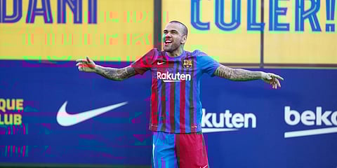 Dani Alves gestures wearing his new team shirt during his official presentation for FC Barcelona in Barcelona, Spain, Wednesday, Nov. 17, 2021. (Photo | AP)