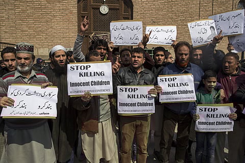 Activists of All Parties Hurriyat Conference (APHC) hold placards during a protest in Srinagar. (File Photo | AP)