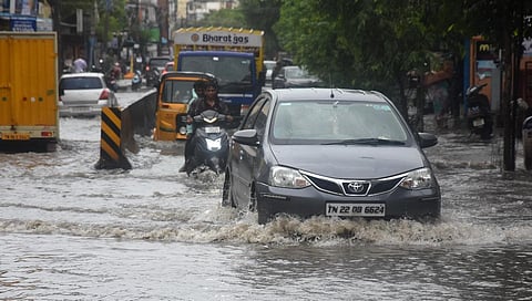 Traffic on the flooded Madipakkam high road on Thursday. Express/ Ashwin Prasath