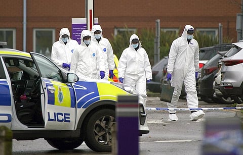 Forensic police officers walk outside Liverpool Women's Hospital after an explosion on Sunday killed one person and injured another (Photo | AP)