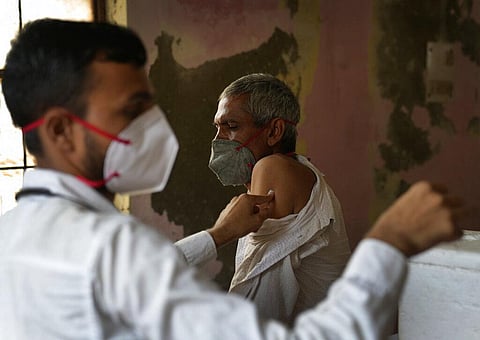 A health worker administers the vaccine for COVID-19 in New Delhi. (Photo | AP)