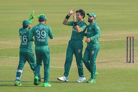 Pakistan cricketers celebrate the fall of a wicket in the first T20 against Bangladesh. (Photo | Twitter)