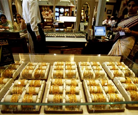 Gold slips Rs 80; silver up Rs 600