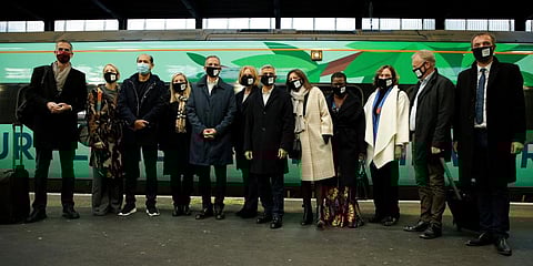 Mayor of London Sadiq Khan (C) poses with a delegation of mayors from other cities beside a train at Euston Station in London. (Photo | AP)
