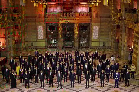 World Leaders pose for a group photo during an evening reception to mark the opening day of the COP26 U.N. Climate Summit, in Glasgow. (Photo | AP)