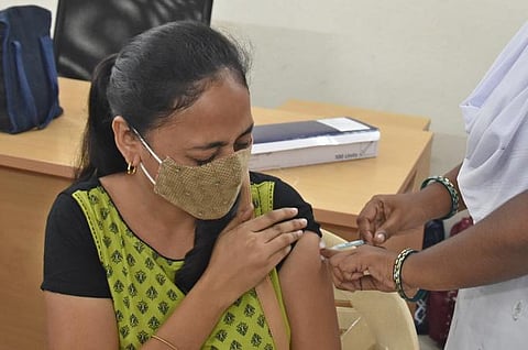 A woman gets Covid vaccine at a health centre at Gunadala in Vijayawada. (Photo | P Ravindra Babu, EPS)