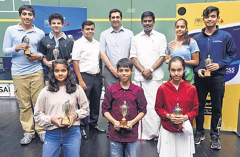 Egmore MLA I Paranthaman and Cyrus Poncha, secretary general of SRFI, with the winners at the Junior Open squash meet in Chennai . (Photo| R Satish Babu, EPS)