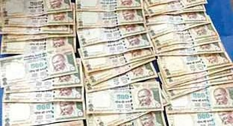 Demonetised banknotes recovered from the Assistant executive engineer of Ranpur Rural Development division Rusinath Baral.