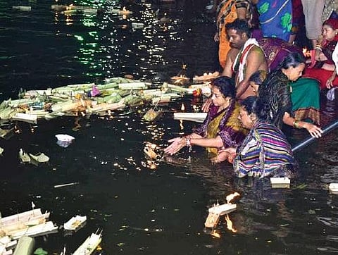 People float miniature boats on the occasion of Kartika Purnima, Nov 19, 2021. (Photo | Express)