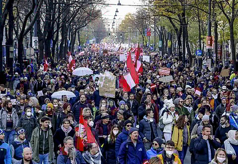 Hundreds of people take part in a demonstration against the country's coronavirus restrictions in Vienna, Austria, Saturday, Nov.20, 2021. (Photo | AP)