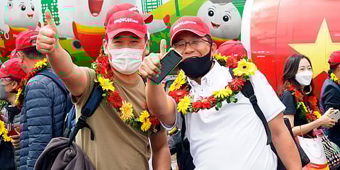 Tourists pose for a photo after landing on Phu Quoc island, in Vietnam. (Photo | AP)