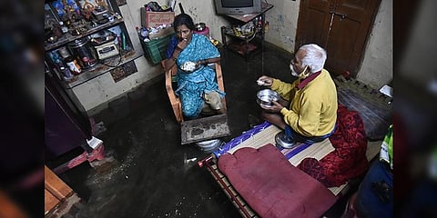 Sundaramurthy and Suguna inside their waterlogged house (EPS Pic I P Jawahar.)