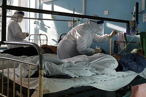 Medics wearing special suits to protect against coronavirus treat patients with coronavirus at an ICU of a hospital in Volgograd, Russia (Photo | AP)